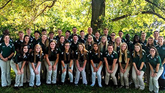 4-h group in front of trees