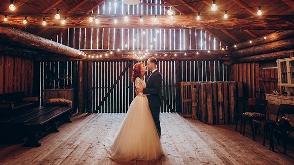 Bride and groom in a barn wedding.