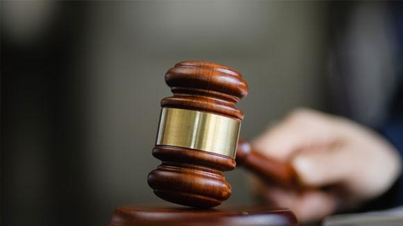 law gavel being struck by hand