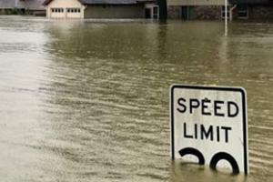 speed sign under flood water