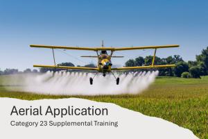 Airplane flying low above a field applying pesticide.