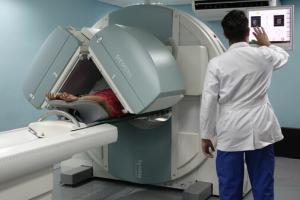 Technician viewing screen by MRI