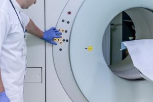 Technician and MRI scanner.