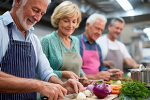 Older adults preparing food in cooking class