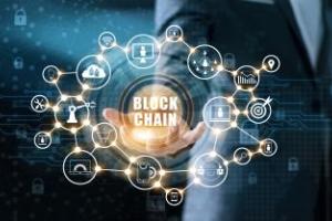 Hand with Blockchain working and graphics around it