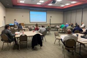 Man giving a lecture in a conference room