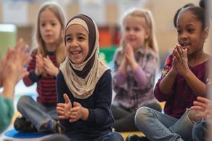 Children clapping during storytime.