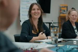 people in the chronic condition class talking and smiling
