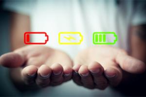 Hands held out with a recharging battery graphic above them.