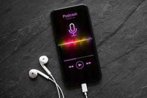 A phone with headphones connected to it.