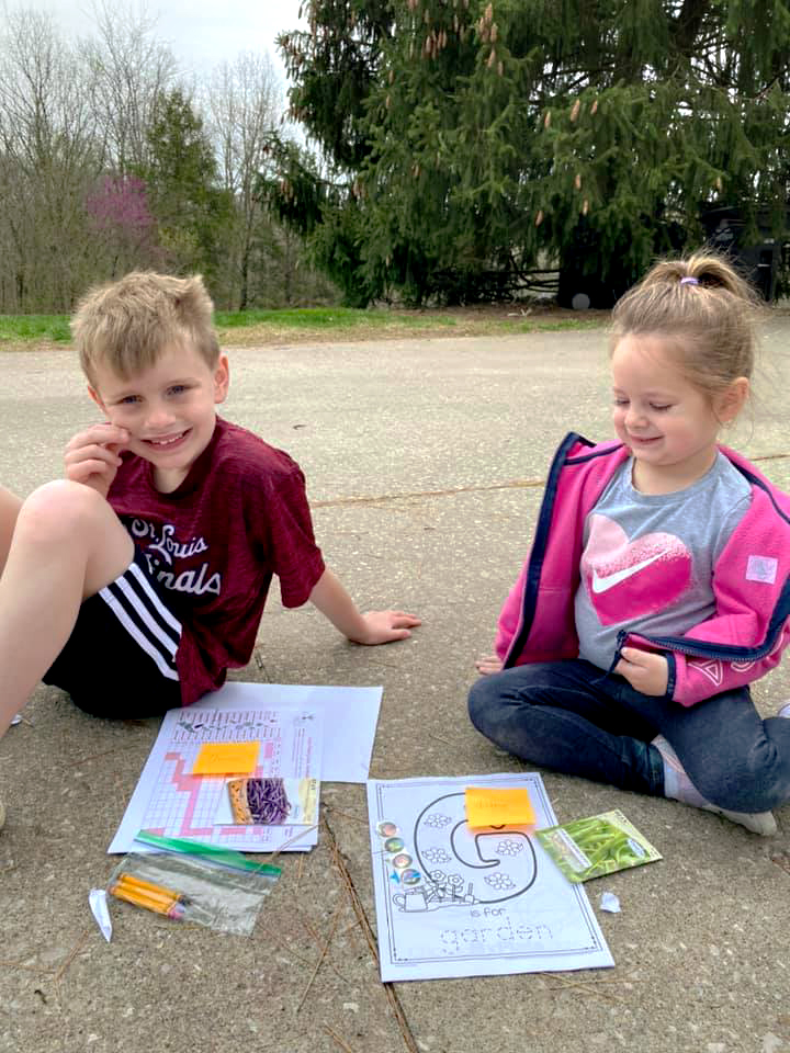 Perry County youths Quintos Kutz, left, and sister Libby received activity and learning packets from MU Extension in Perry County.