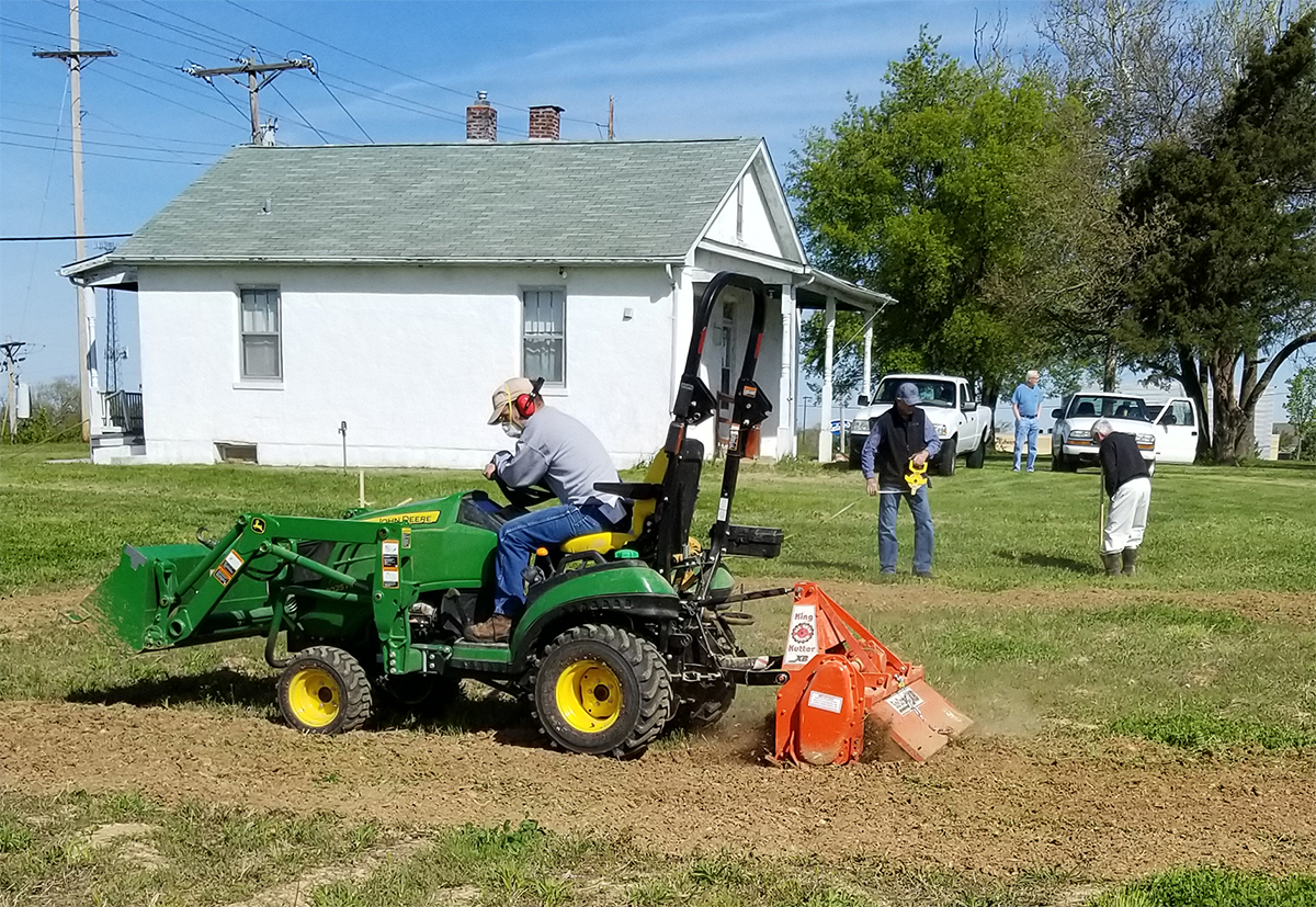 Master Gardener Tom Ruf tills ground on the site of a new community garden at St. John's Lutheran Church in Arnold, Mo. Photo courtesy Jefferson County Master Gardeners.