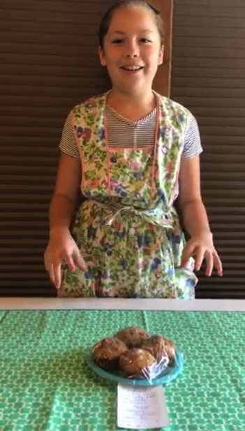 Audrey Tinoco presents her prize-winning muffins via FaceTime at the Saline County fair.