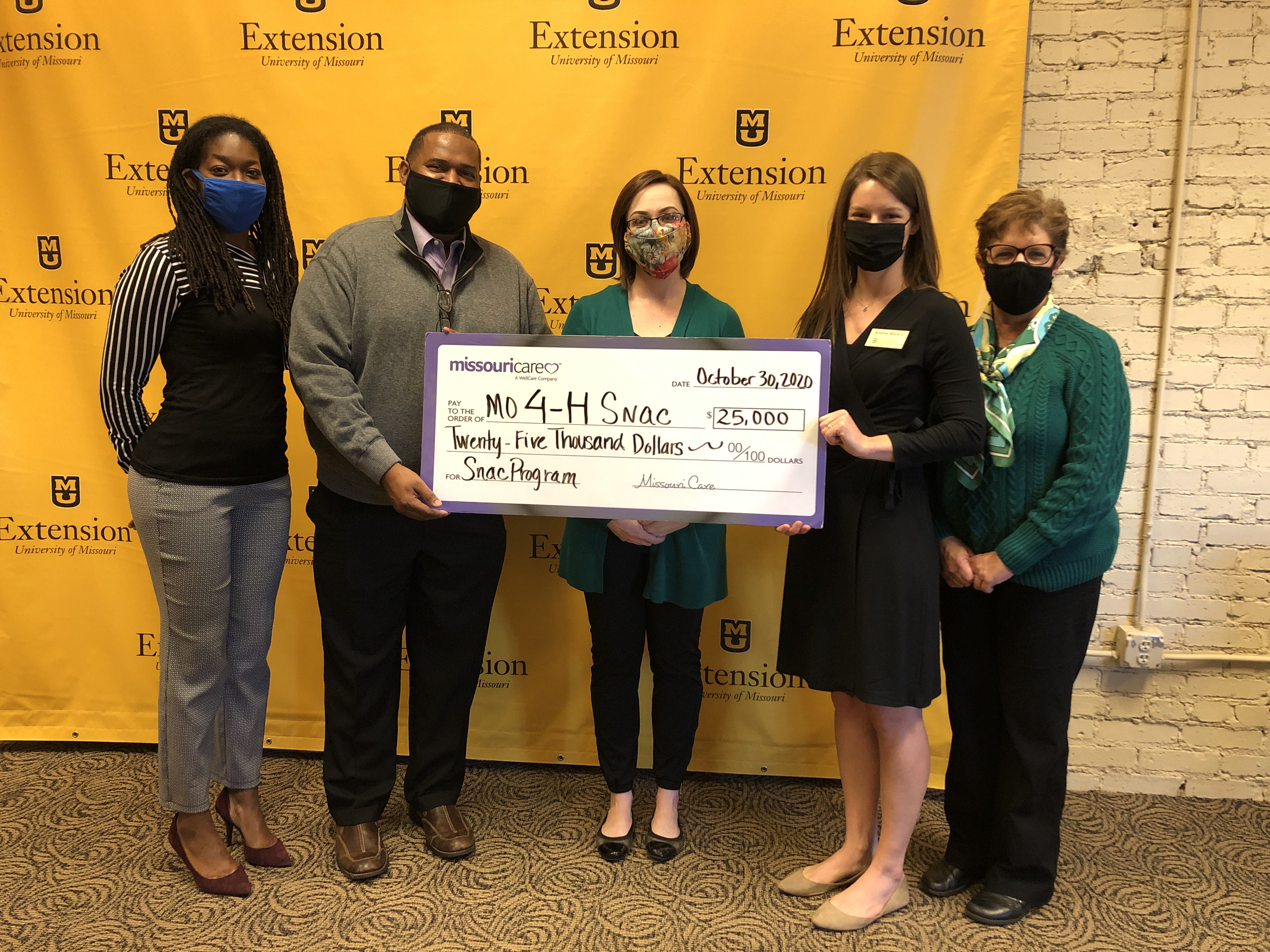 From left, Nyala Bulock and Ed Williams of Missouri Care; Rachel Augustine, director of the Missouri 4-H Foundation; 4-H youth development specialist Andrea Wikiera; and Lupita Fabregas, director of the Missouri 4-H Center for Youth Development. Bulock an