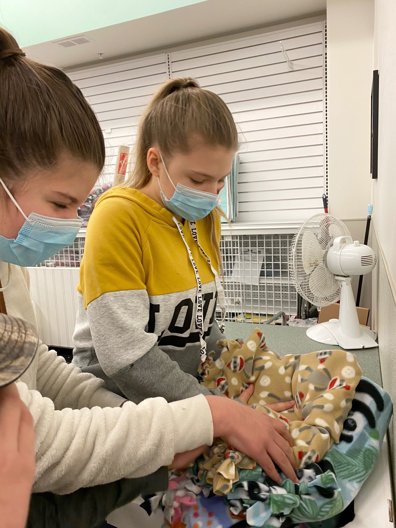 Boone County 4-H'ers Chloe Beal, left, and sister Zoe working on blankets for Project Linus.