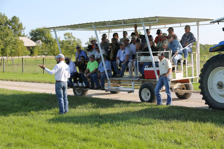 Eric Bailey, assistant professor of animal sciences and state extension beef specialist, talks with farmers during a field day at the MU Forage Systems Research Center in Linneus, Mo. Photo taken pre-COVID.