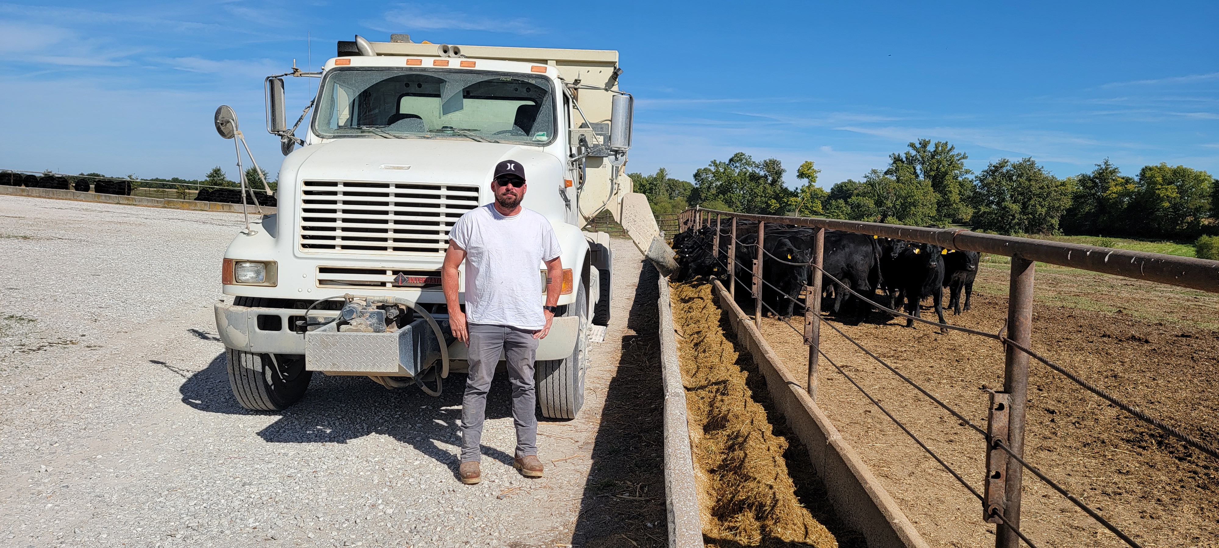 Trevor Cockrell, a 12-year employee of Hopewell Farms in Monroe County, feeds cattle as part of his work to keep the beef and grain operation running smoothly. The owners, the Fodge family, rely on their employees to keep the 5,000-acre operation going. P