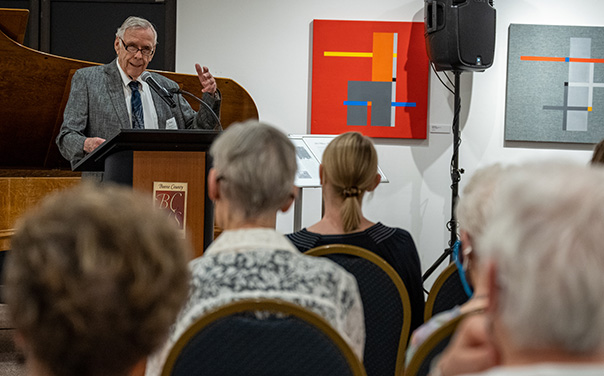 A man giving a speech at a podium.