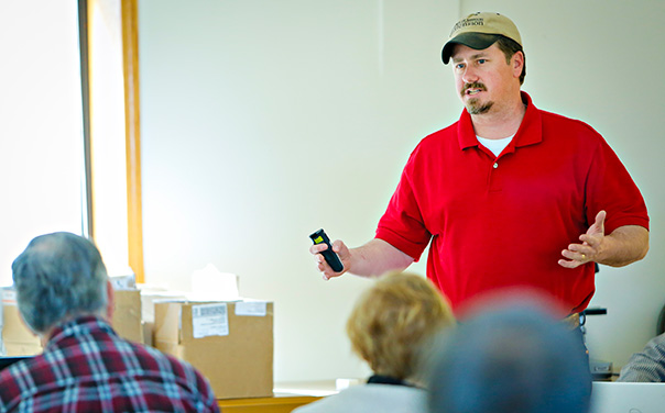 Wesley Tucker gives a presentation in front of an audience.