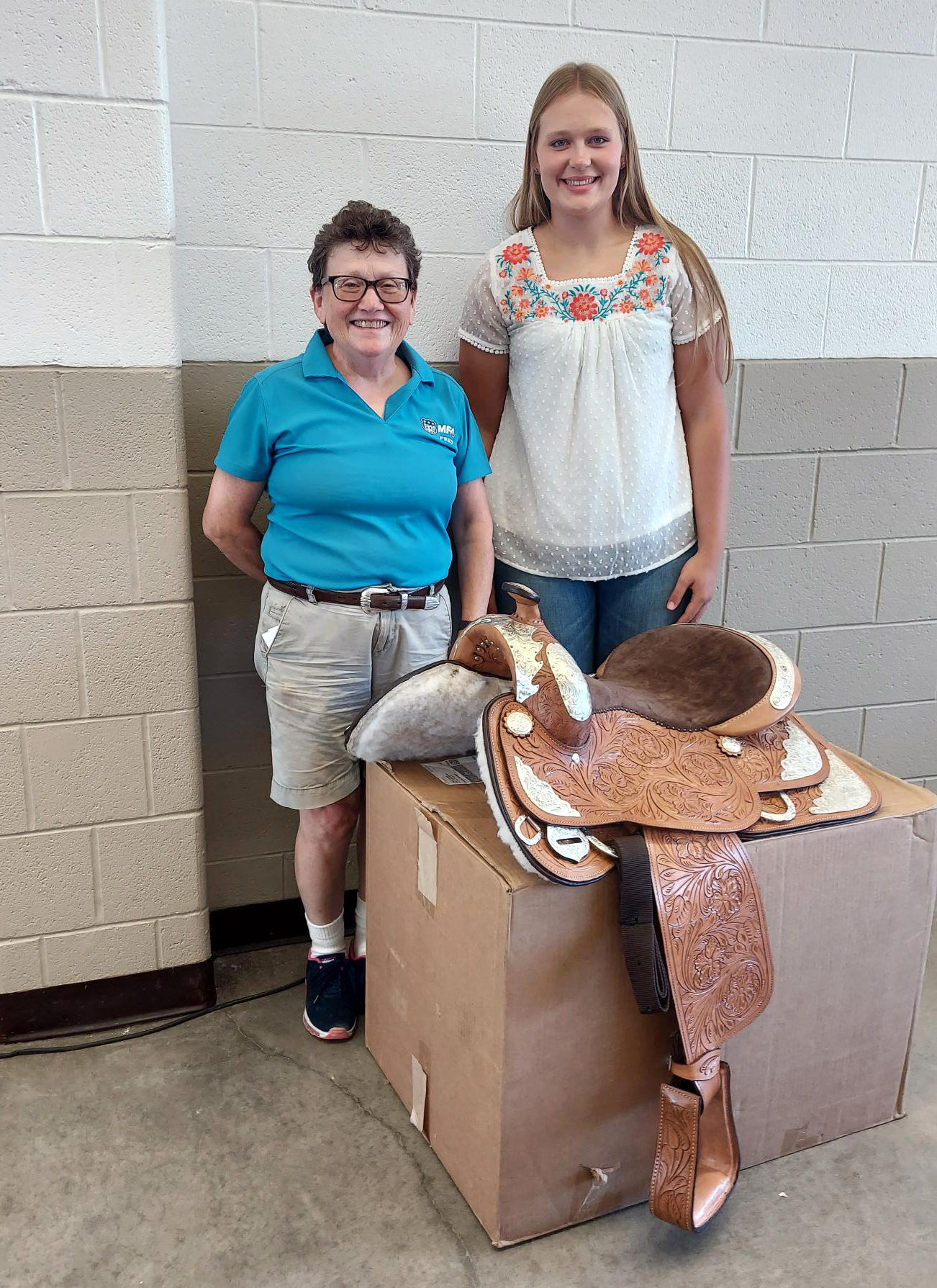 The MFA Saddle Award, sponsored by MFA Inc., was presented by Janice Spears, left, to Avery Ridgley of Montgomery County.