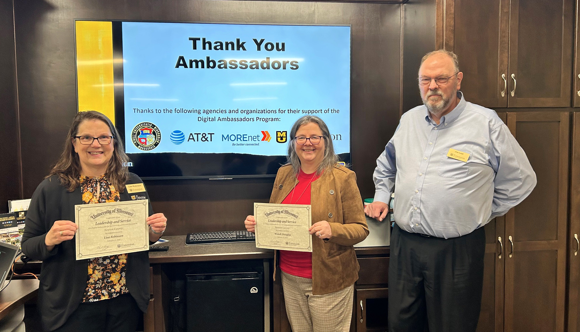 MU Extension specialist Lisa Robinson, left, and community member Wendi Douglas, center, completed Digital Ambassador training in Newton County. Joe Lear, right, consultant for UM System broadband initiatives, guided participants through the course.