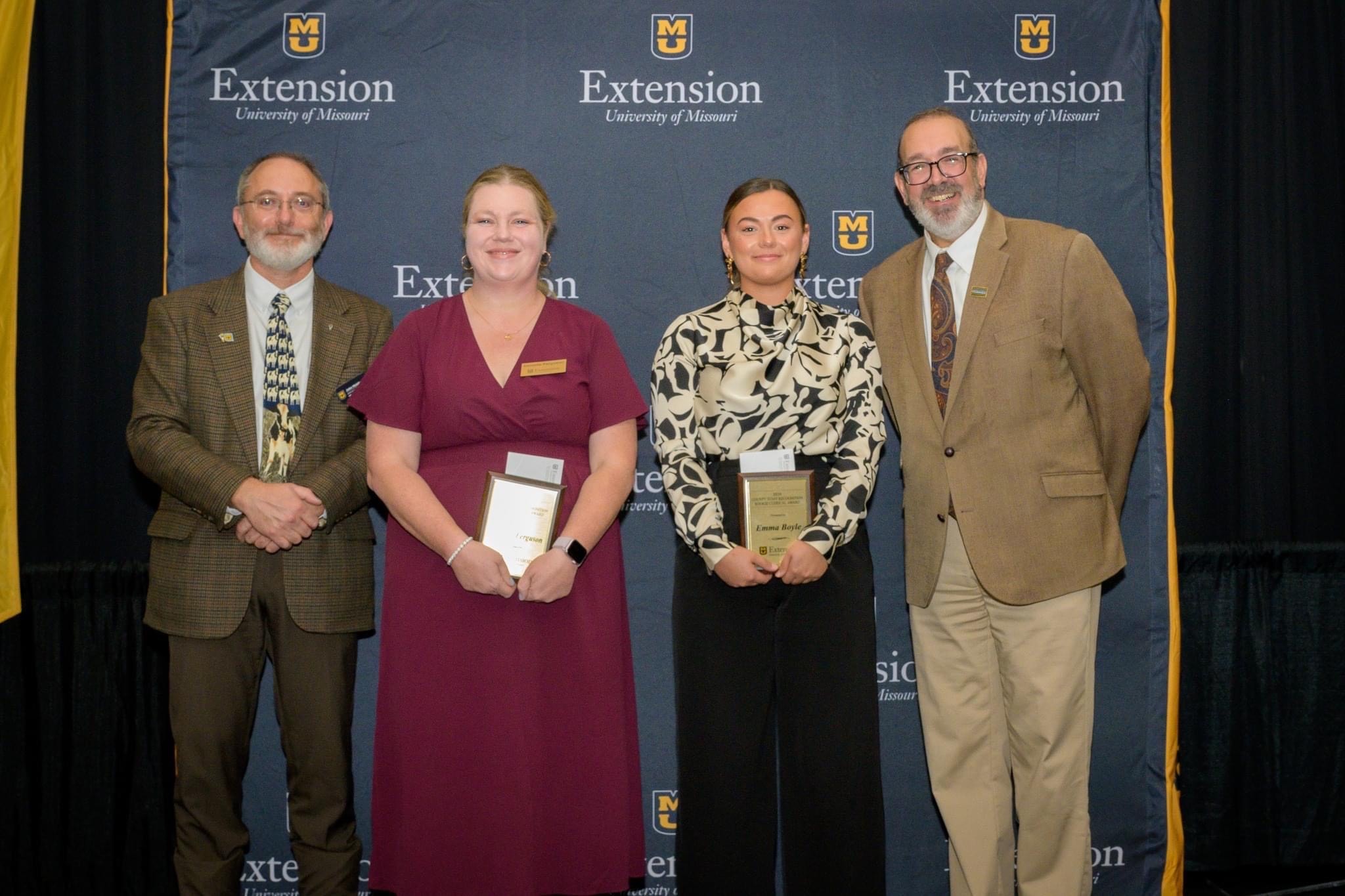 Danielle Ferguson, second from left, Buchanan County office manager, receiving the Junior County Clerical Award.