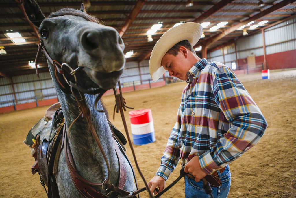 Zane works with Sage at the Lazy B Arena. The 3-year-old quarter horse will be used by a client for riding, but needs some breaking in first.Photo by Kyle Spradley, University of Missouri