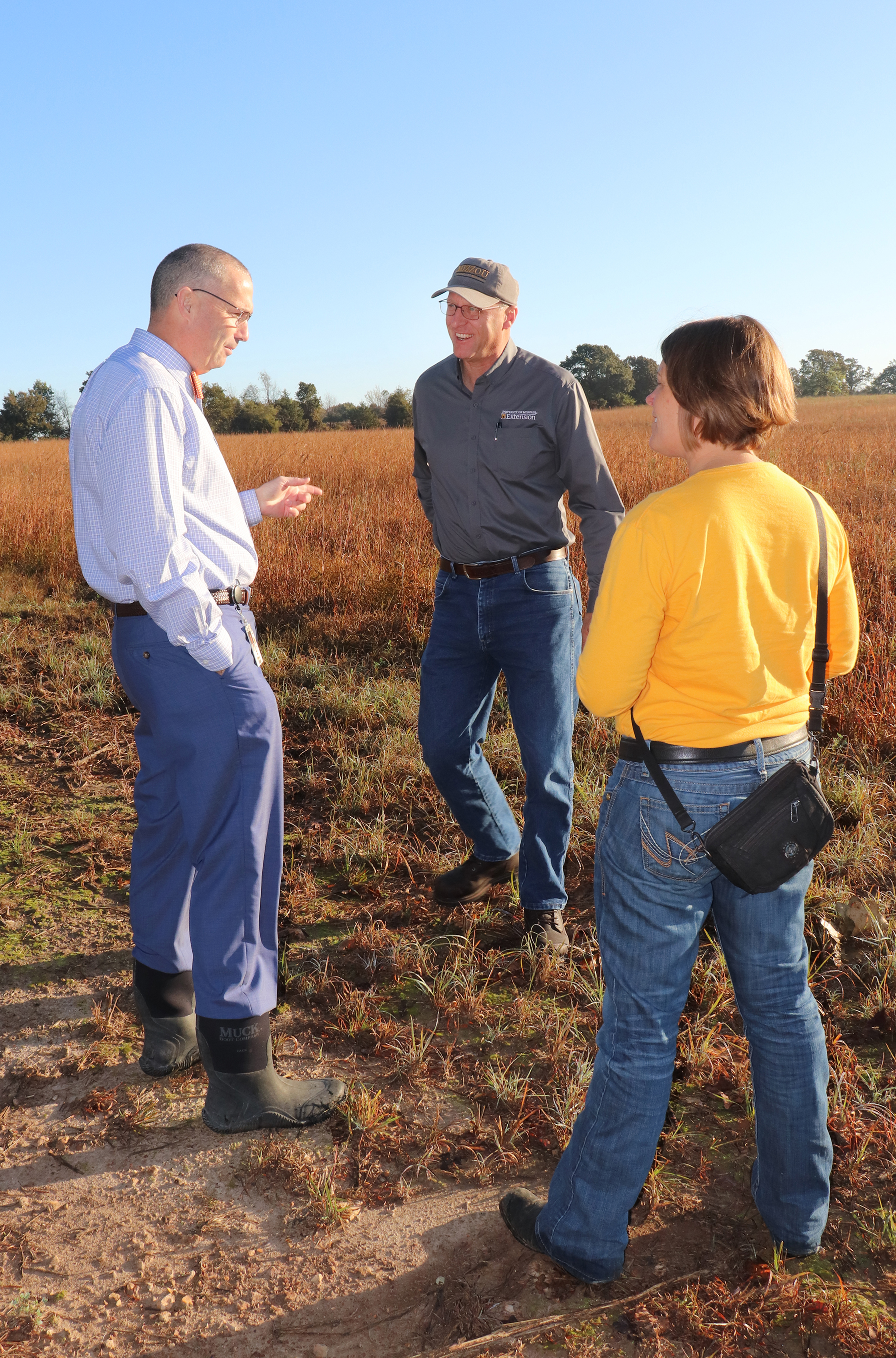 Richard Asbill, left, is one of the first participants in NRCS + MU Grasslands Project. Warm-season grasses on his southwestern Missouri farm provide habitat for wildlife and forage for cattle. Also pictured are extension agronomist Tim Schnakenberg, cent